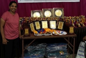Shruti poses along with trophies and mementos to be presented 