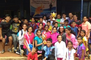 Athletes from Goenka Education Trust, winners of the boys-girls combined team championships pose with the chief guest Nimesh Desai,  a former champion and an Asian Games medalist (Green T-shirt) and other officials 