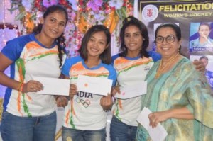 Members of the Indian women's hockey team Sushila Chanu, Vandana Katariya, and Rajani with former international Happy Mann