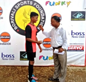 Maryland United’s young striker Johnson Mathews receives the ‘Big Boss Player of the Match’ award from Bro. Alphonso, Chairman of St. Francis Technical College 