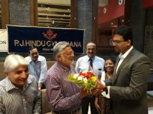 Dr. Iqbal Bagasrawala being welcomed by Dr. Ankur Phatarpekar, while Dr.Kishore Gundecha looks on.  