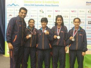 The girl's TT team posing with their silver medal that they won in Slovenia.