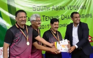 Indian men’s plus 65 team winners (from left)- Satish Kulkarni,. Deepak Dudhane,Suhas  Kulkarni and Ulhas Shirke, with their gold medals.